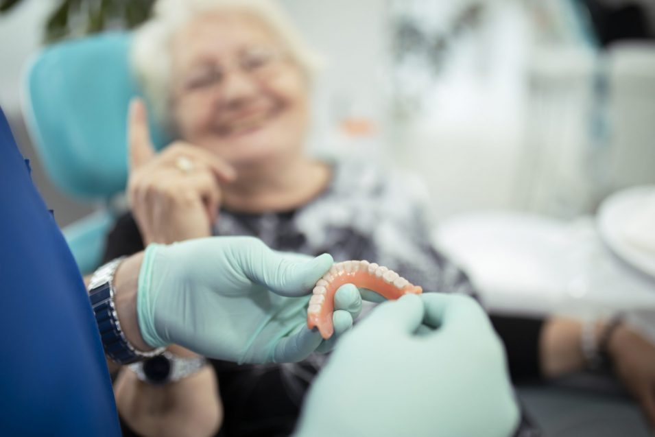 Image Alt Text – Elderly lady discussing restorative dentistry with dentist in Mindemoya