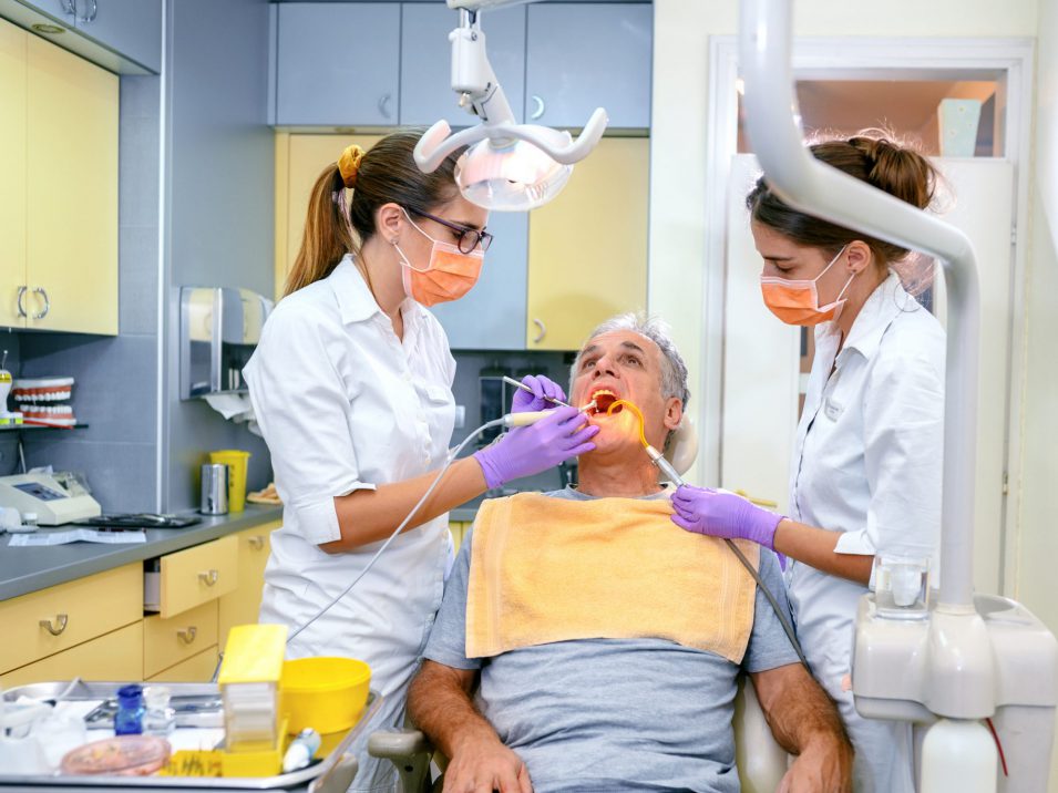 Man receiving root canal from a dental specialist in Mindemoya